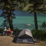 Couple camping close to lake